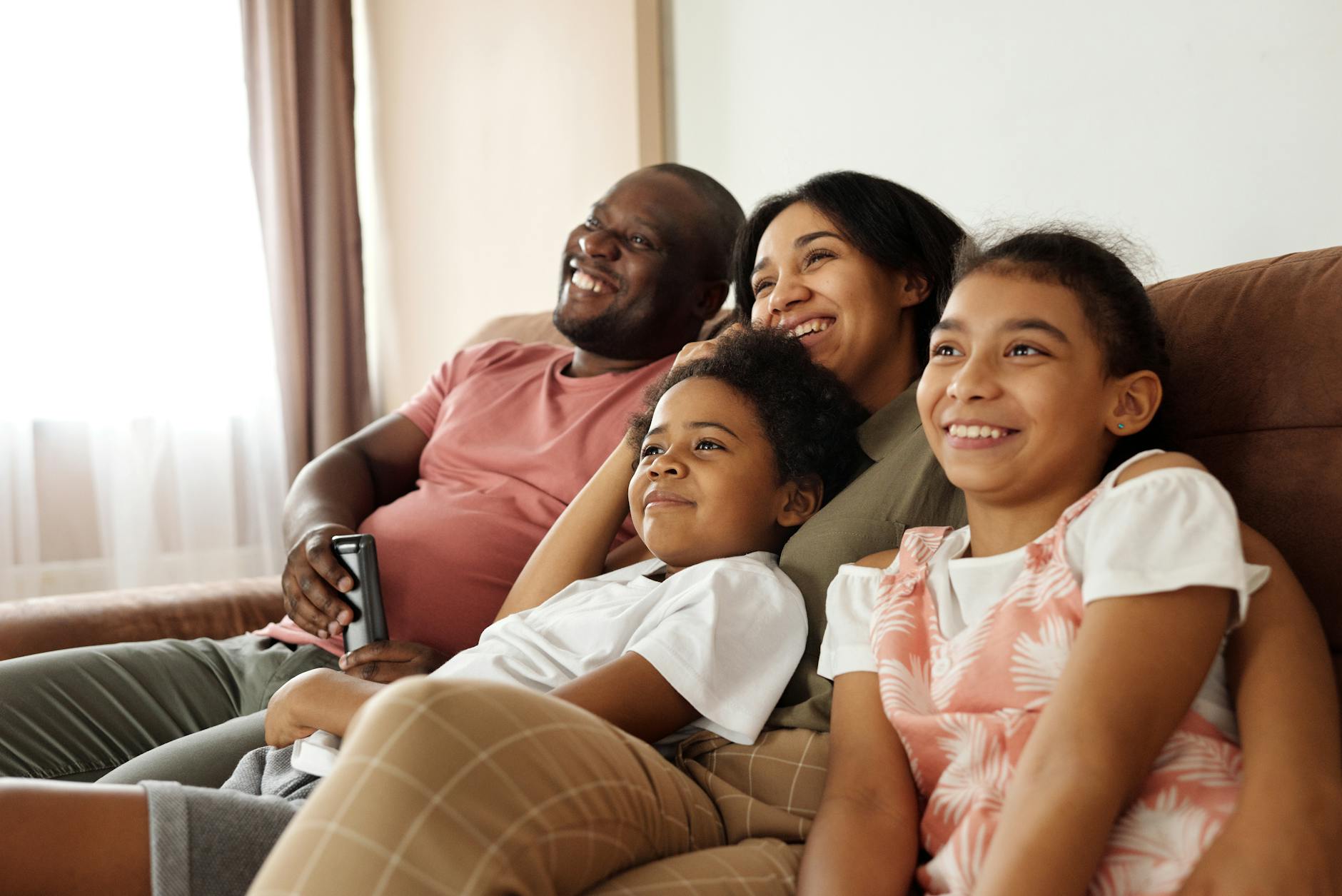 happy family sitting on a couch